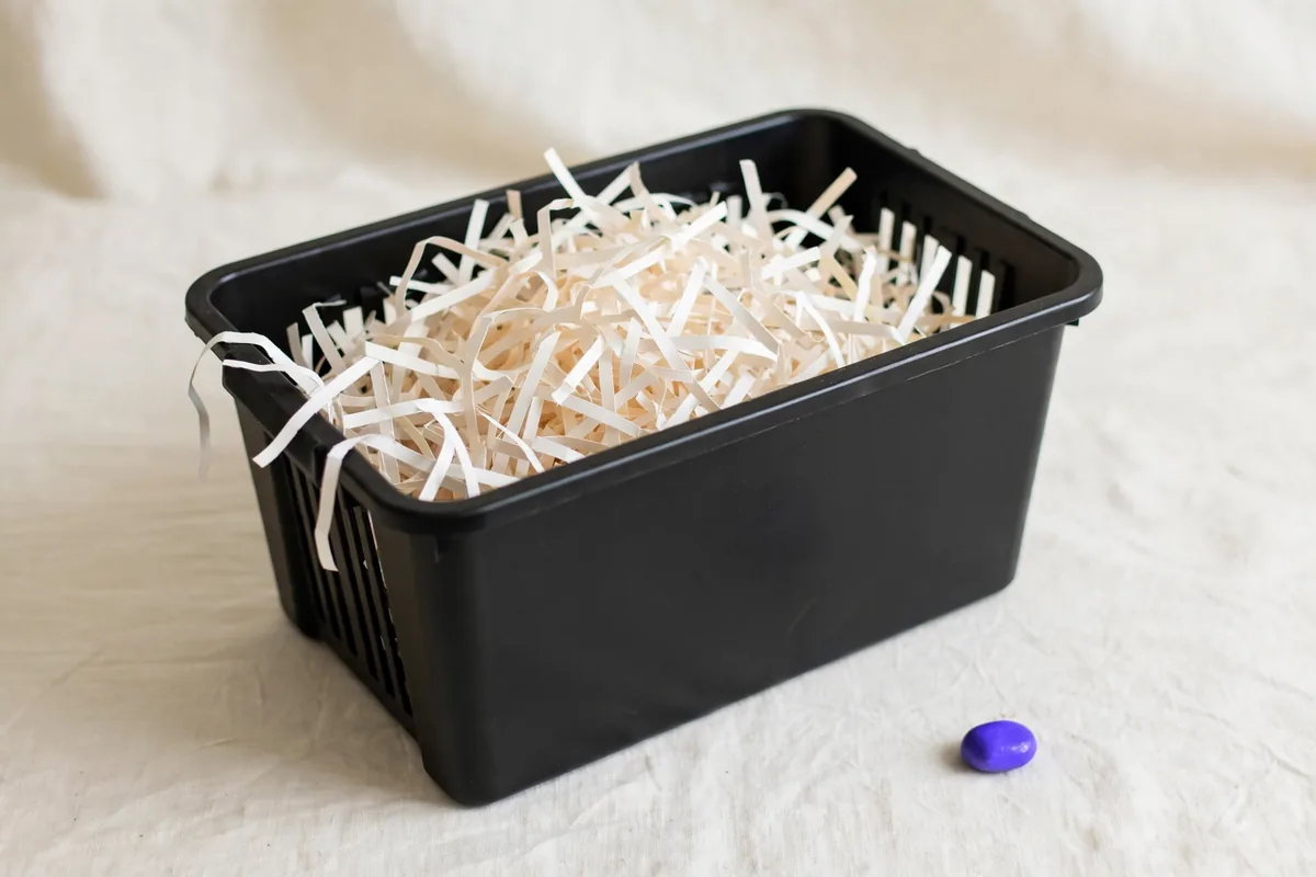 A paper shredder basket with blank strips
